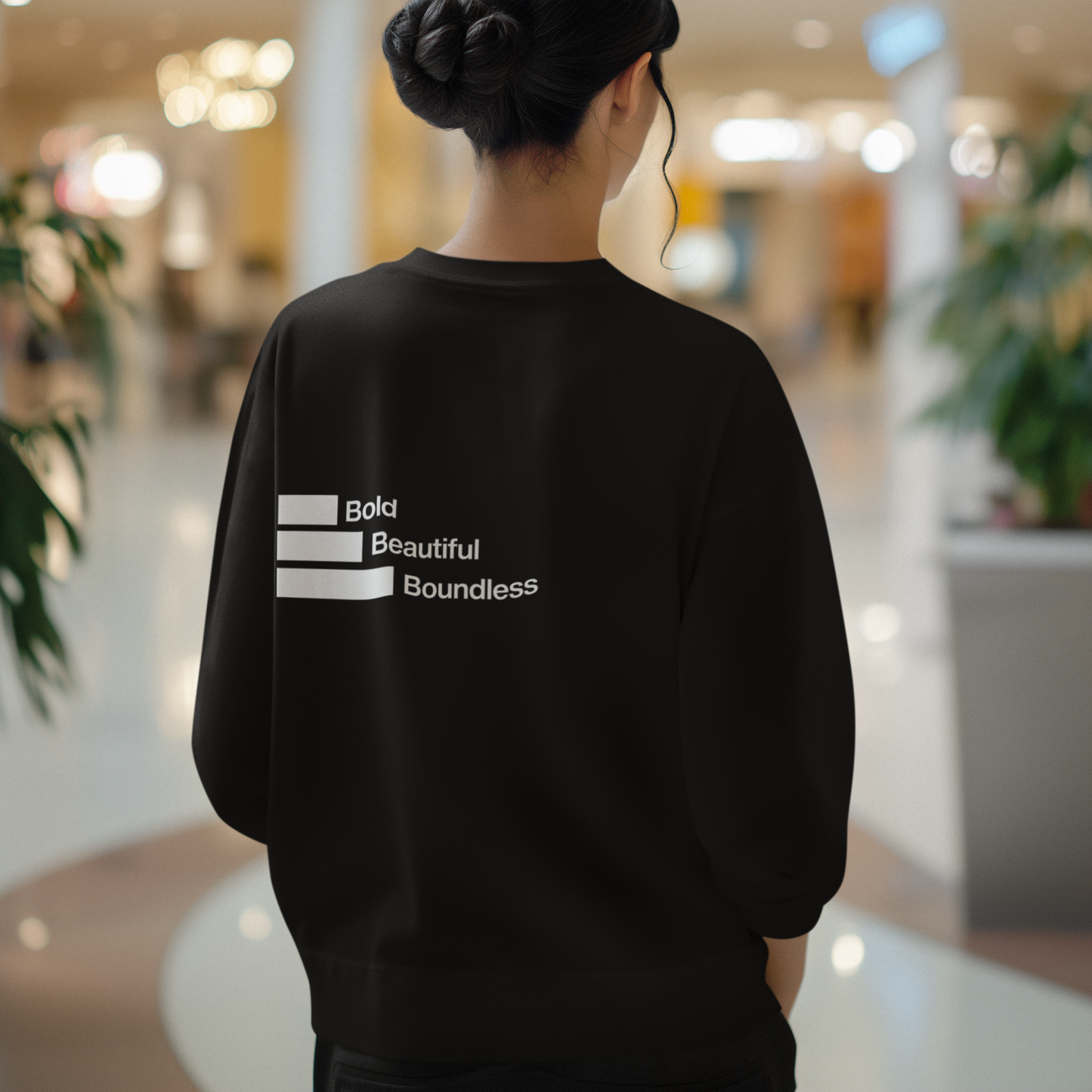 back-of-womans-boundless-black-color-sweatshirt