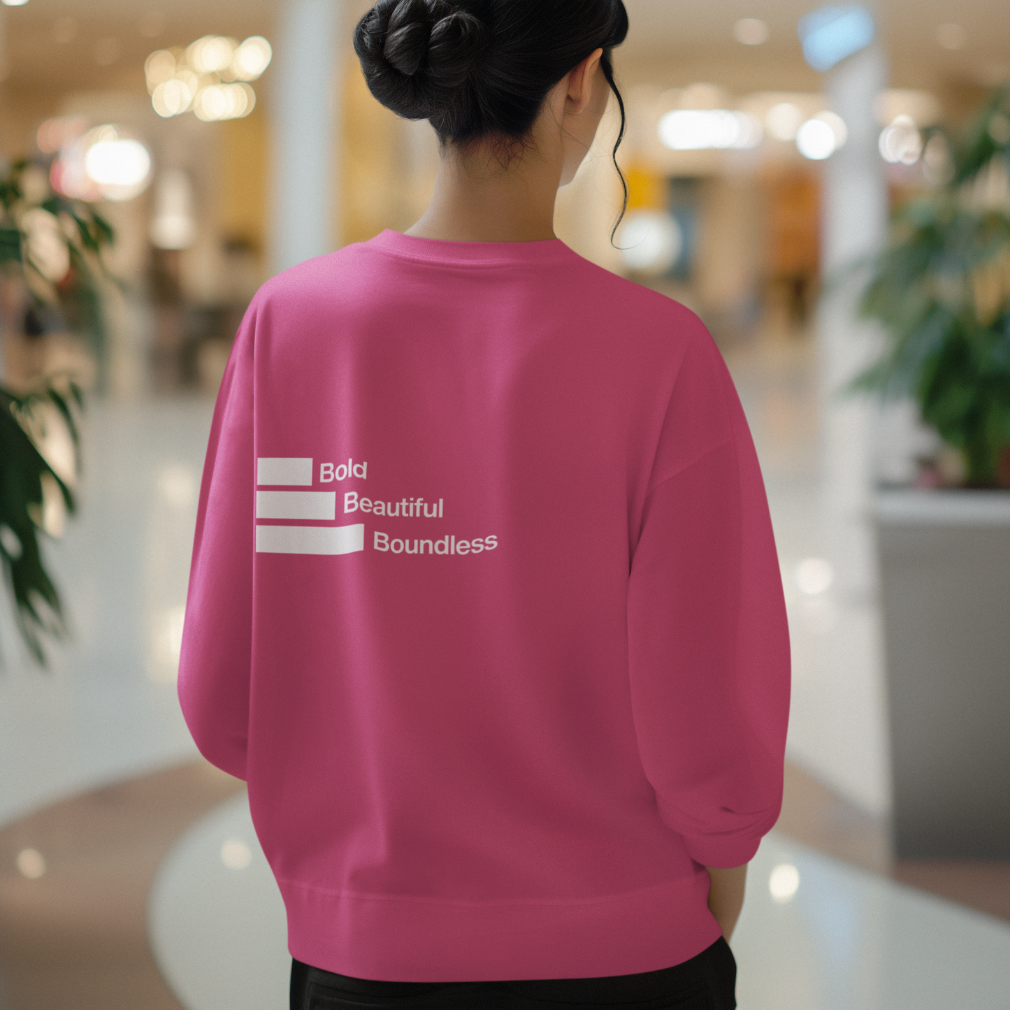 back-of-womans-boundless-heliconia-color-sweatshirt