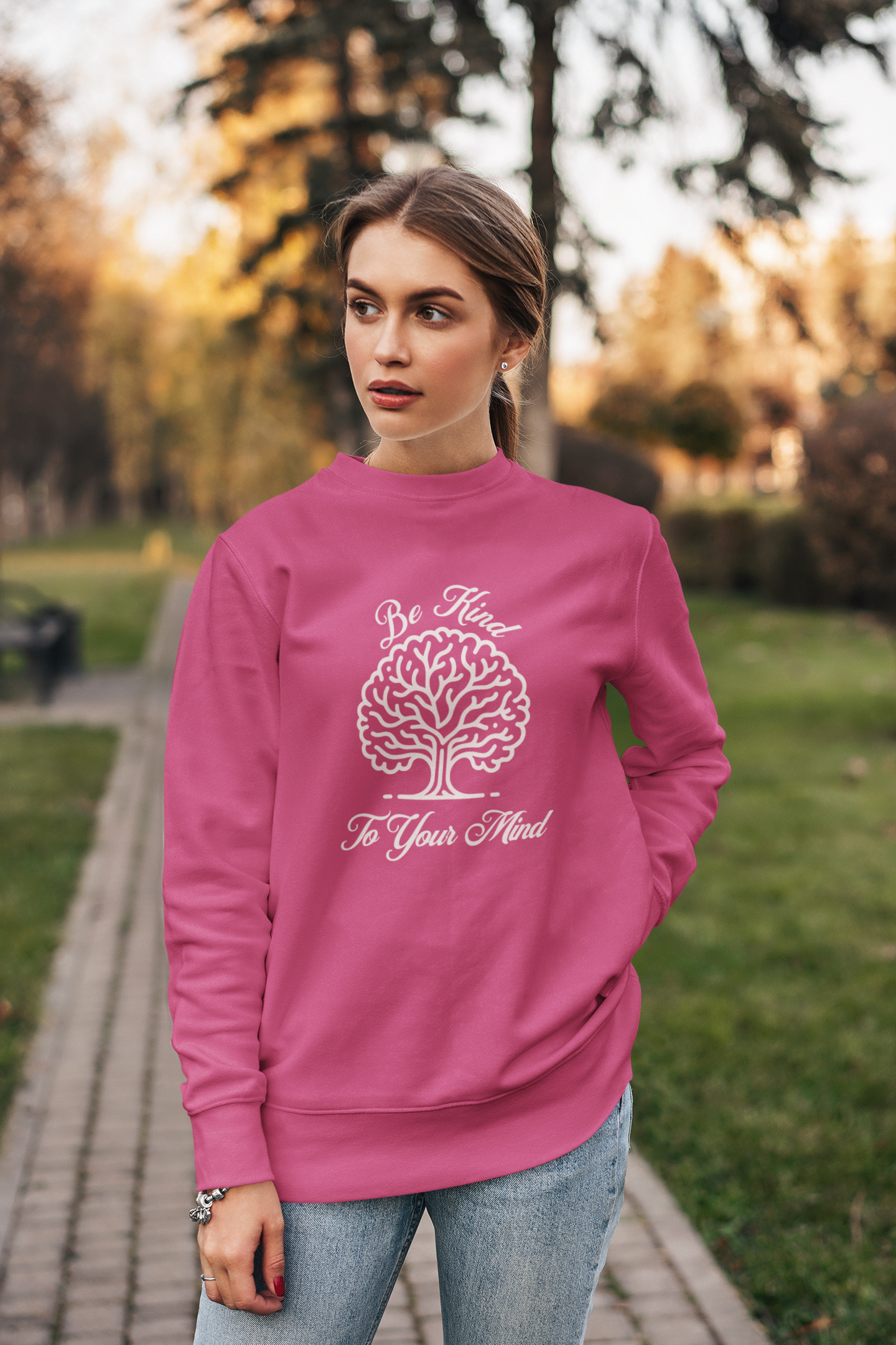 crewneck-sweatshirt-of-a-serious-woman-posing-in-a-garden-wearing-be-kind-to-your-mind-shirt-heliconia