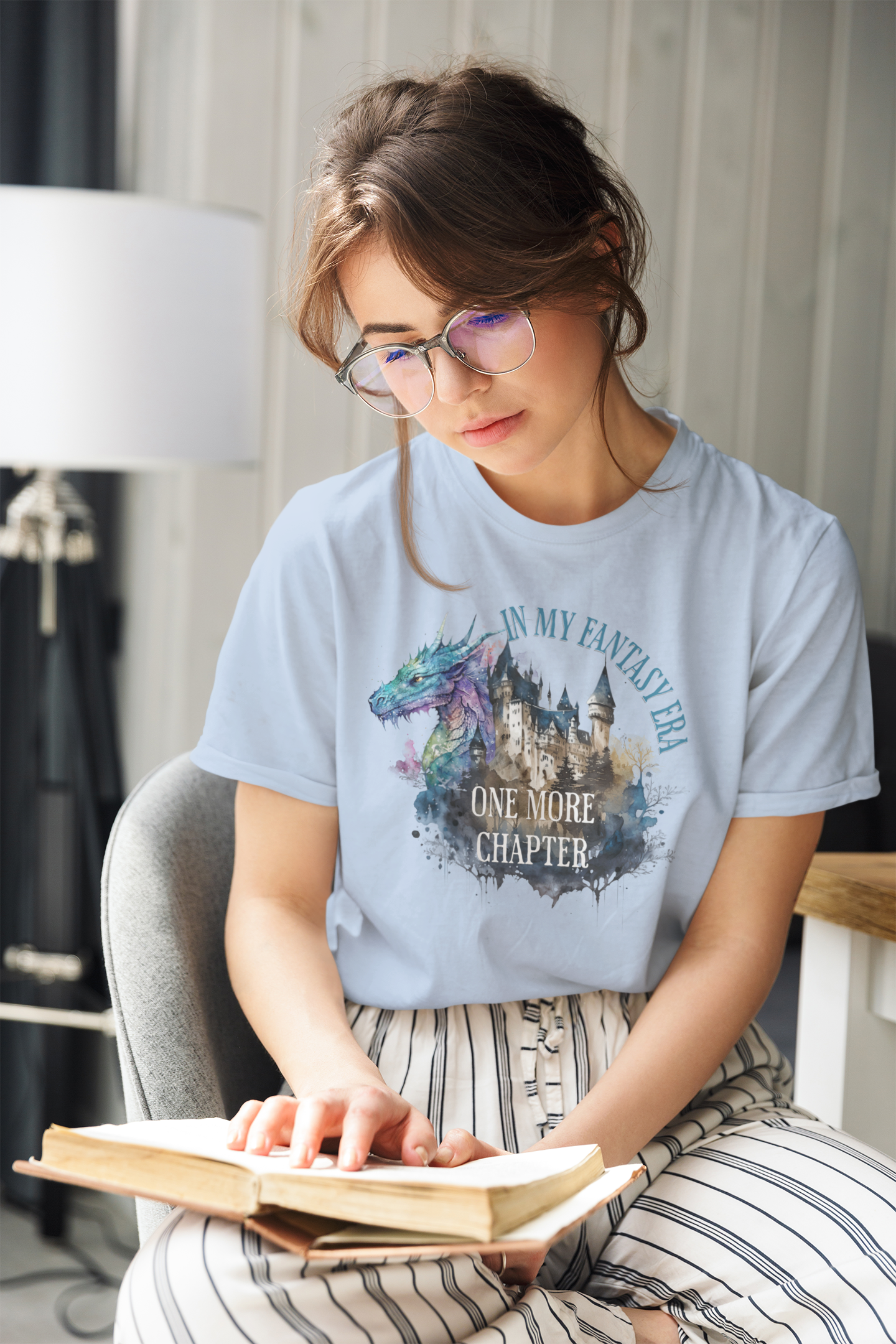 in-my-fantasy-era-woman-tee-of-a-woman-reading-at-home-baby-blue
