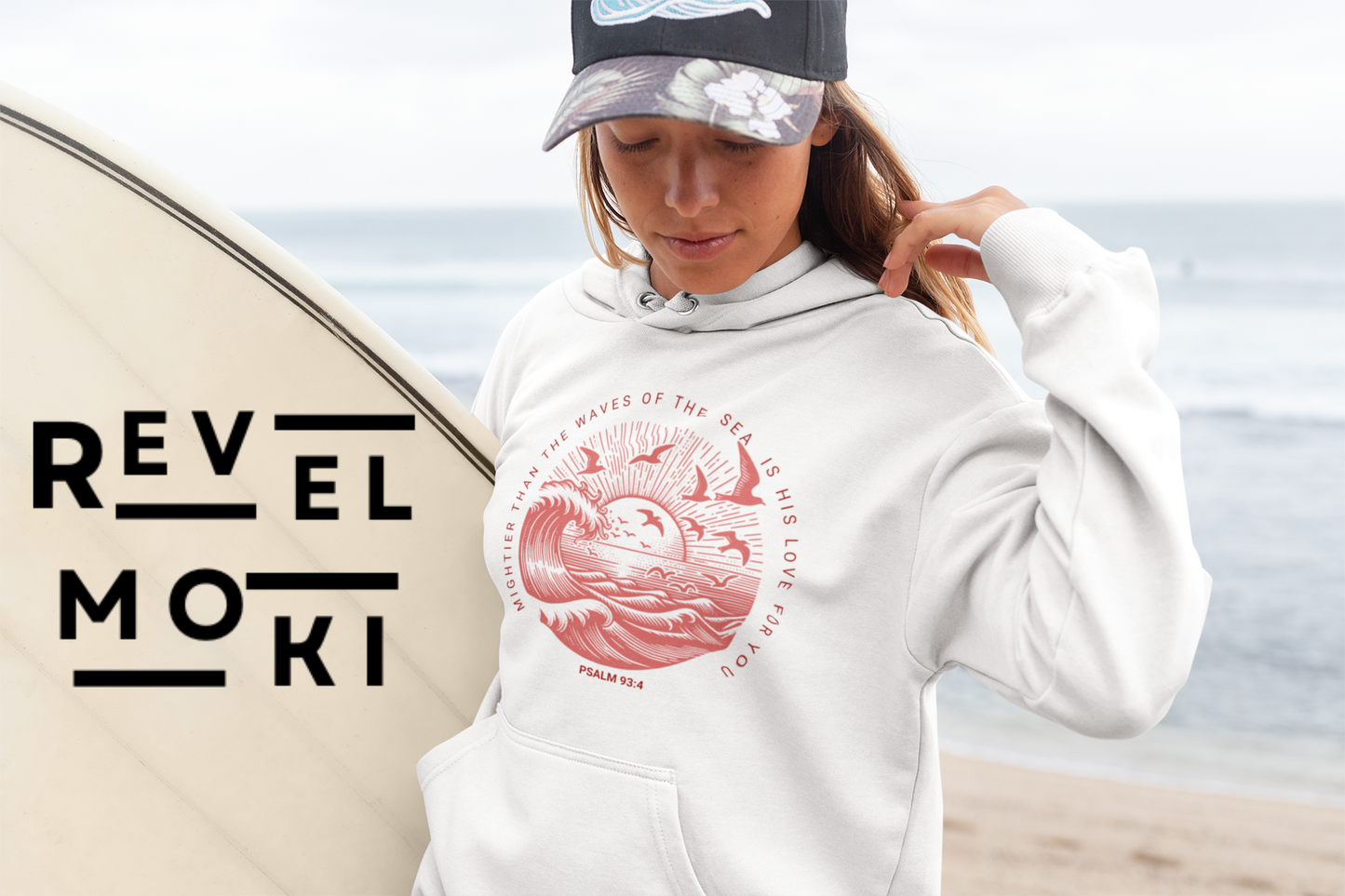 pullover-christian-design-hoodie-mockup-of-a-surfer-woman-carrying-her-board-at-the-beach