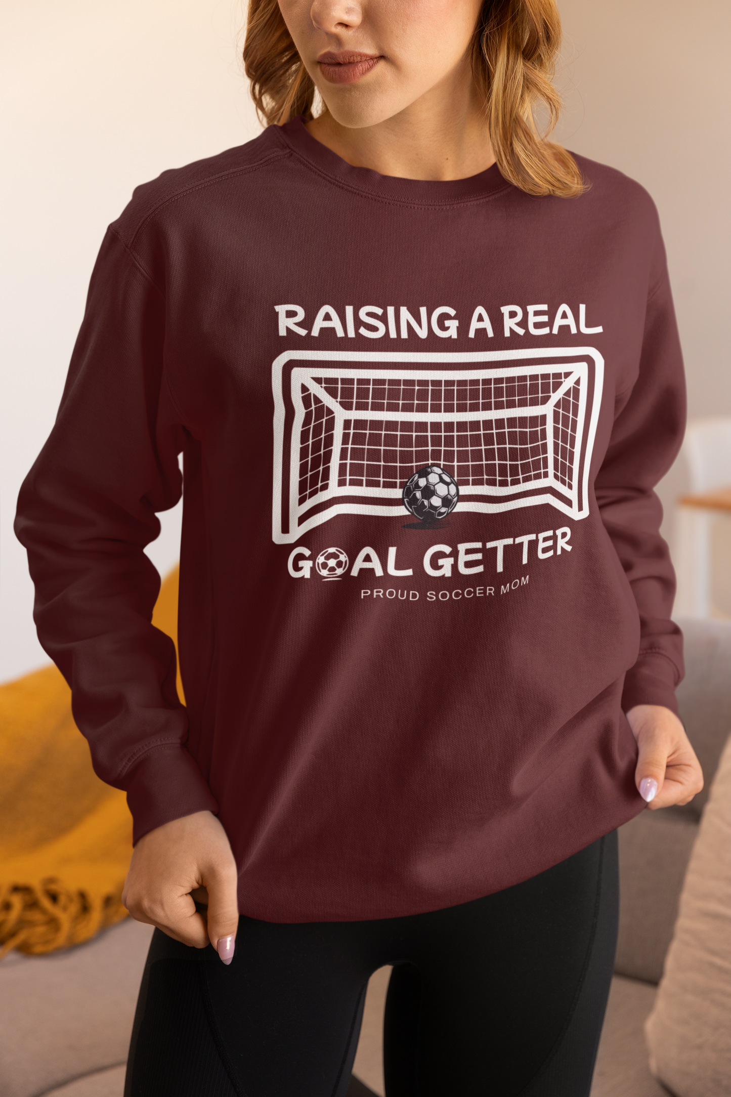 raising-a-real-goalgetter-soccer-mom-sweatshirt-maroon