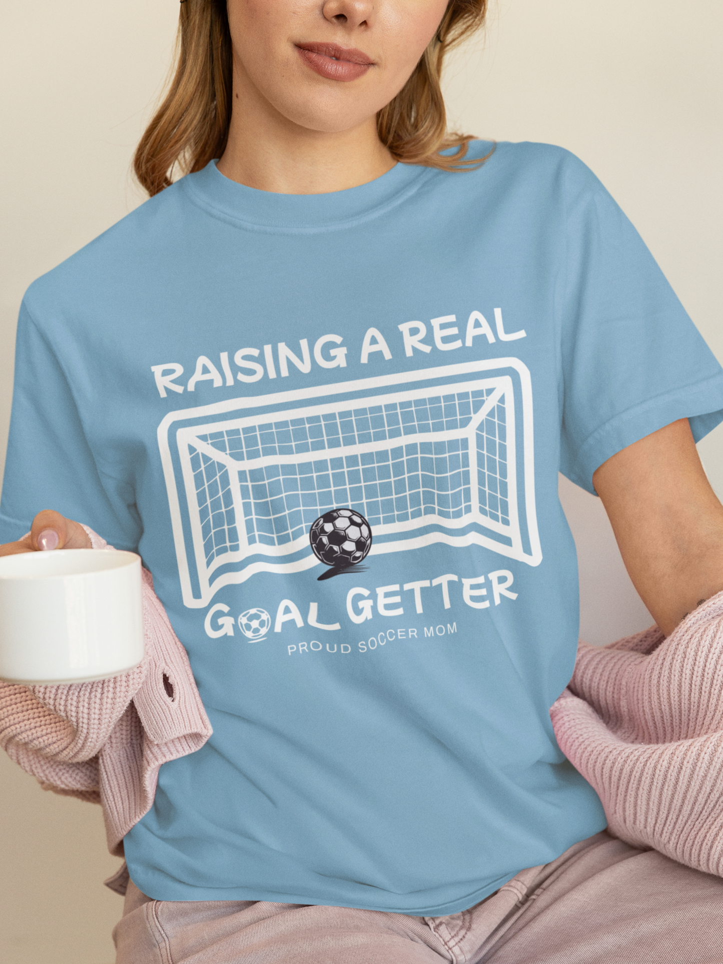 raising-a-real-goalgetter-soccer-mom-tee-baby-blue