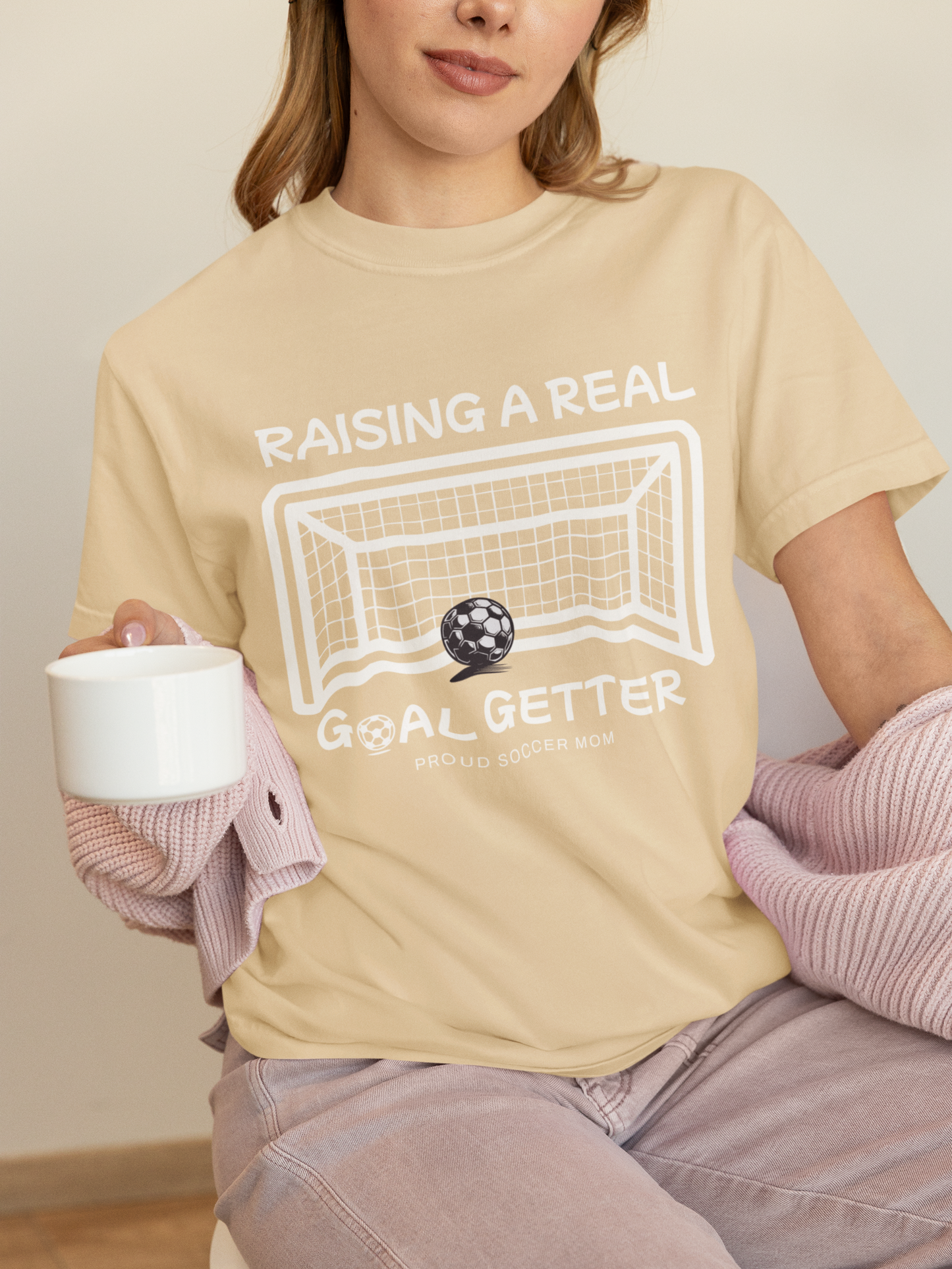 raising-a-real-goalgetter-soccer-mom-tee-soft-cream