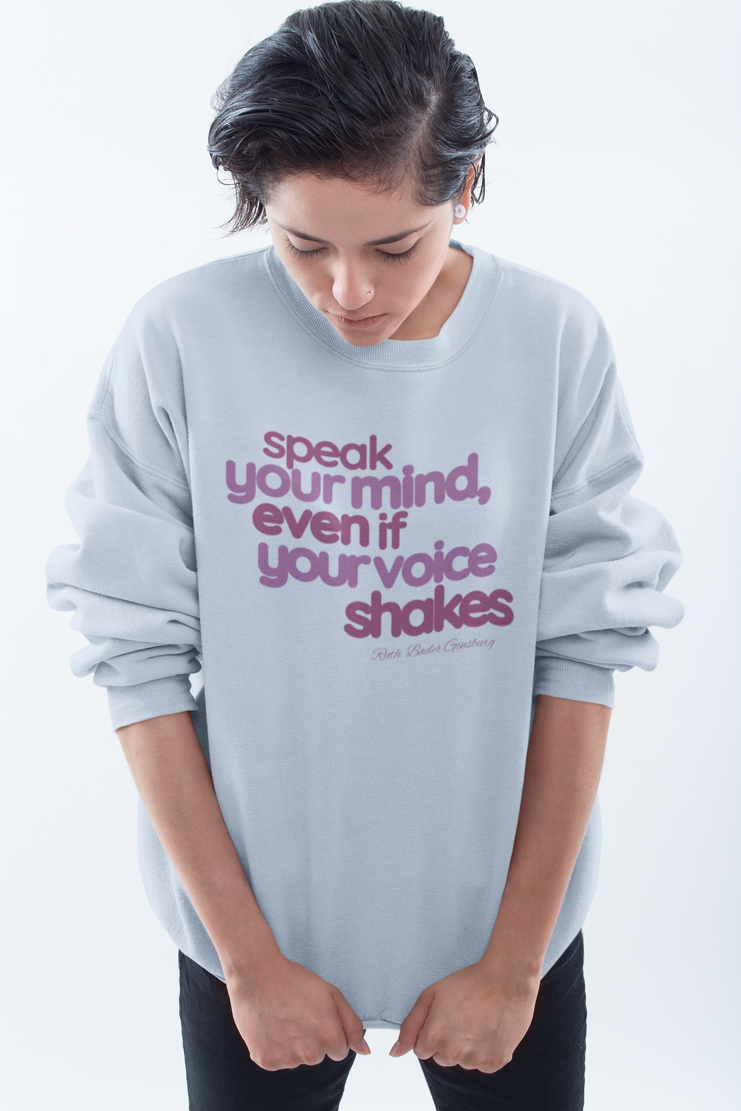 short-haired-woman-pulling-down-her-sweatshirt-wearing-women-empoowerment-shirt-blue