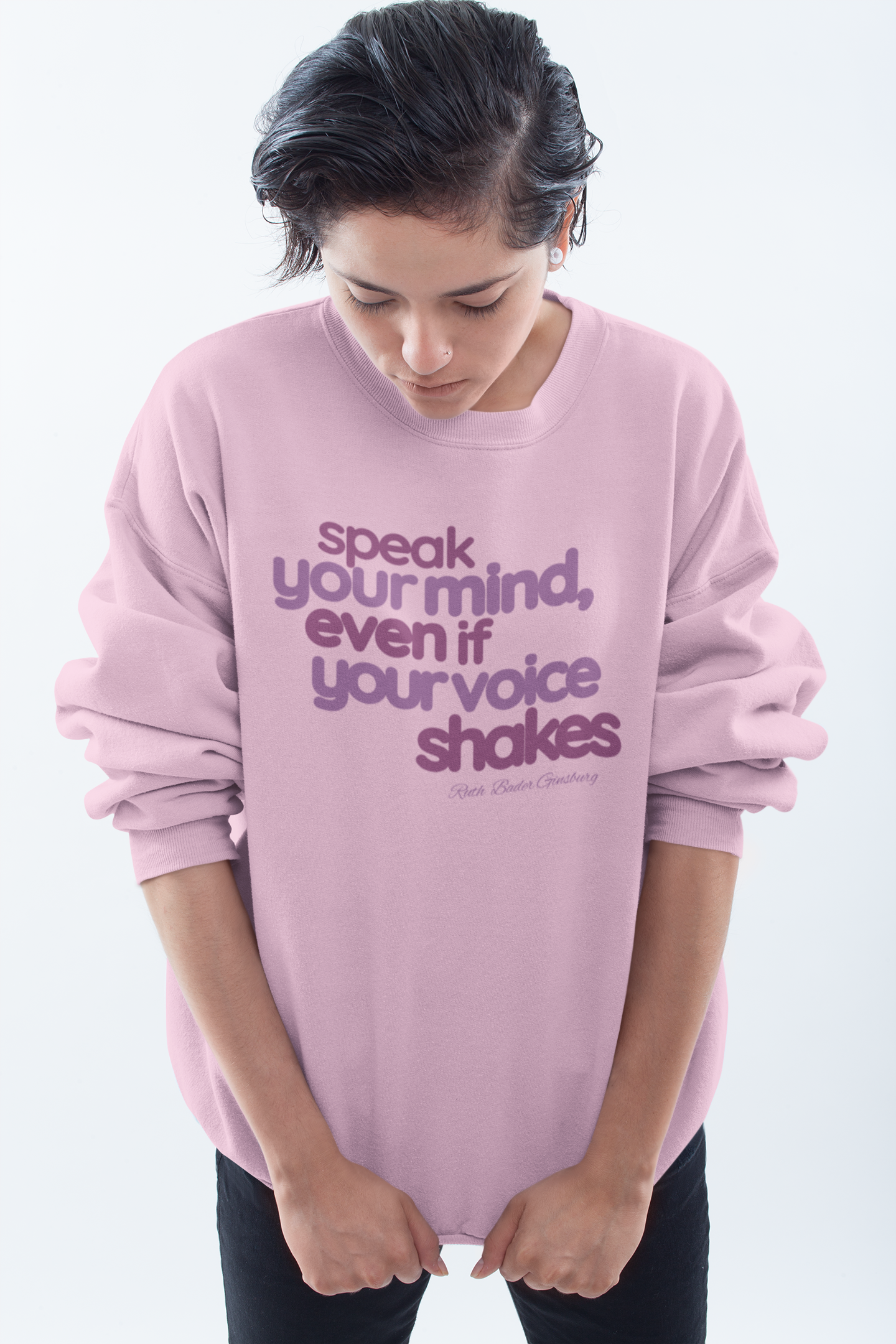 short-haired-woman-pulling-down-her-sweatshirt-wearing-women-empoowerment-shirt-pink