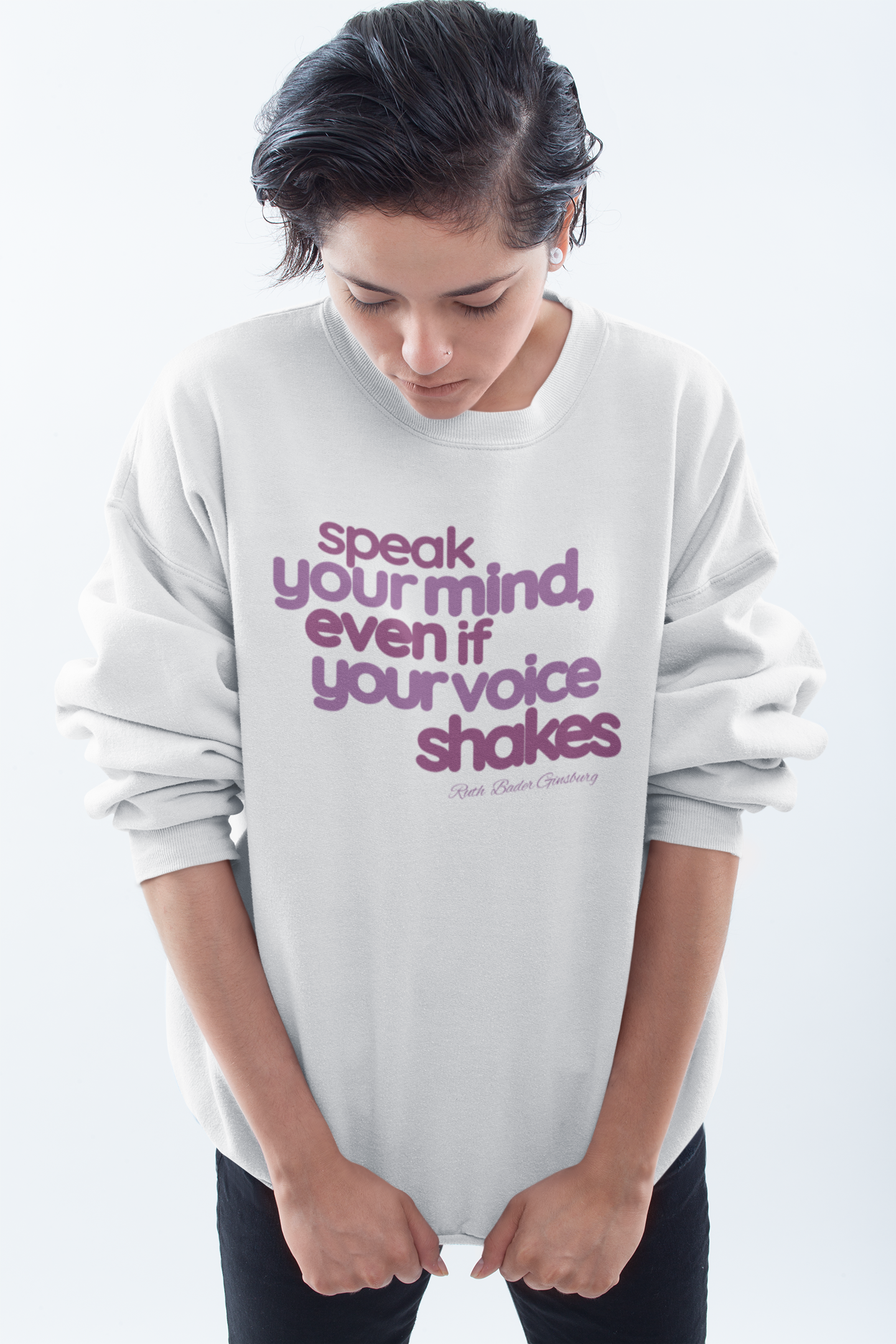 short-haired-woman-pulling-down-her-sweatshirt-wearing-women-empoowerment-shirt-white