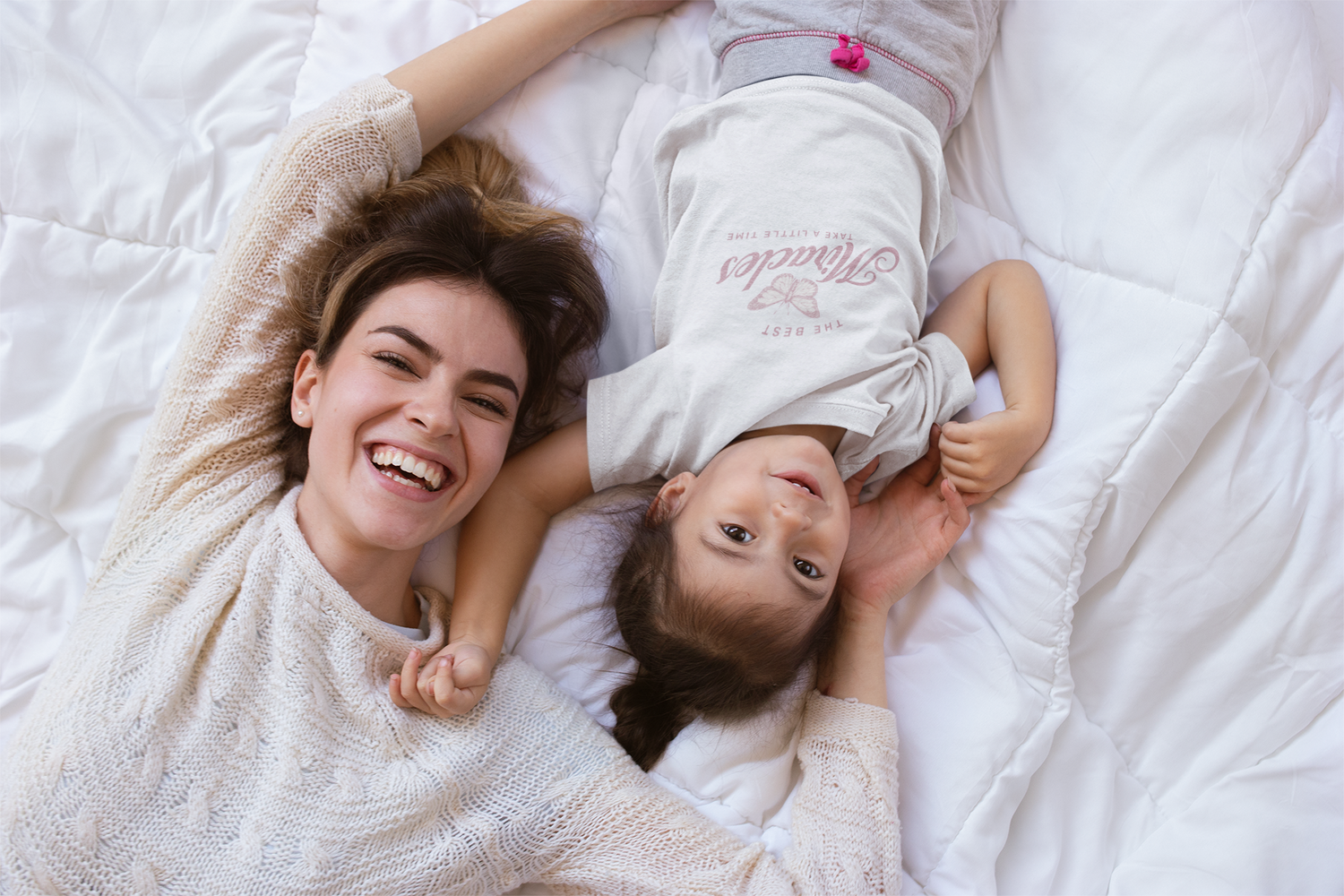 t-shirt-mockup-of-a-little-girl-lying-down-with-her-mom