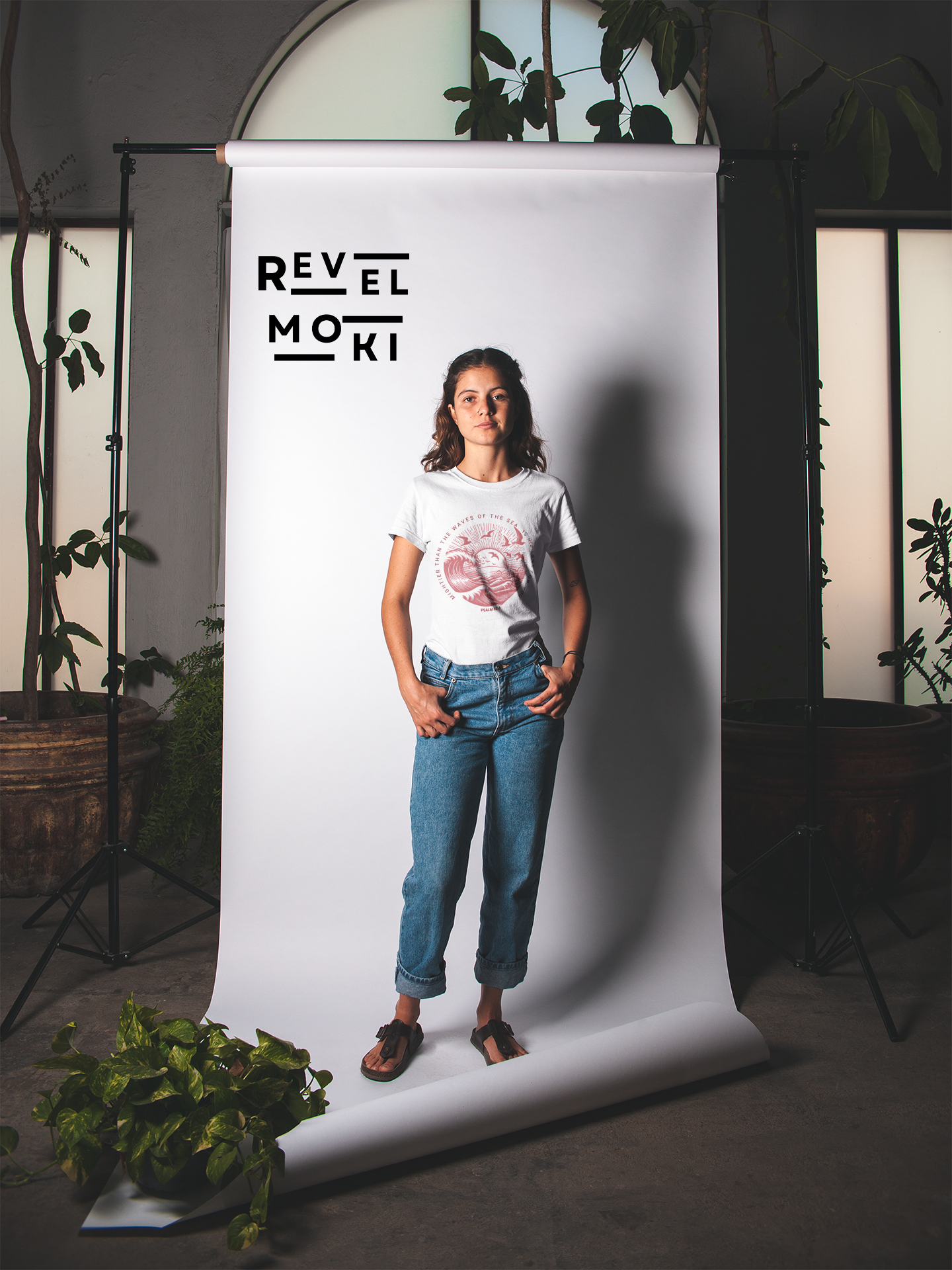 t-shirt-mockup-of-a-woman-surrounded-by-plants-in-a-studio-setting