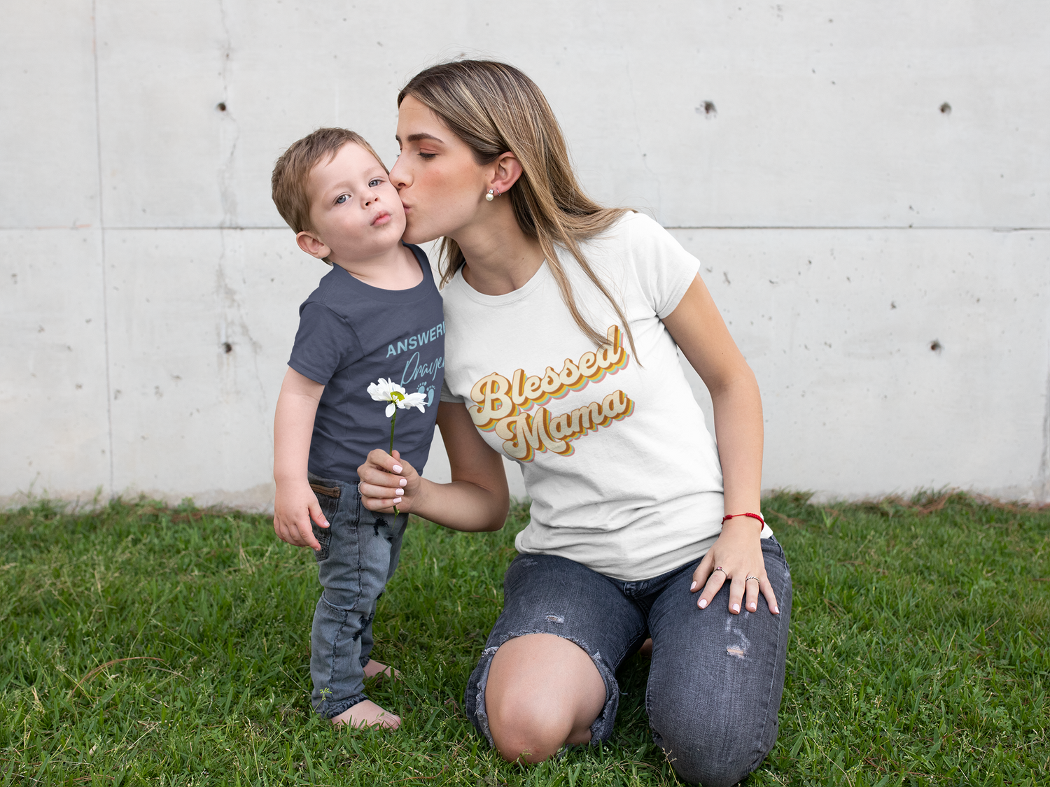 t-shirt-mockup-of-a-young-mom-kissing-her-little-son-at-a-lawn