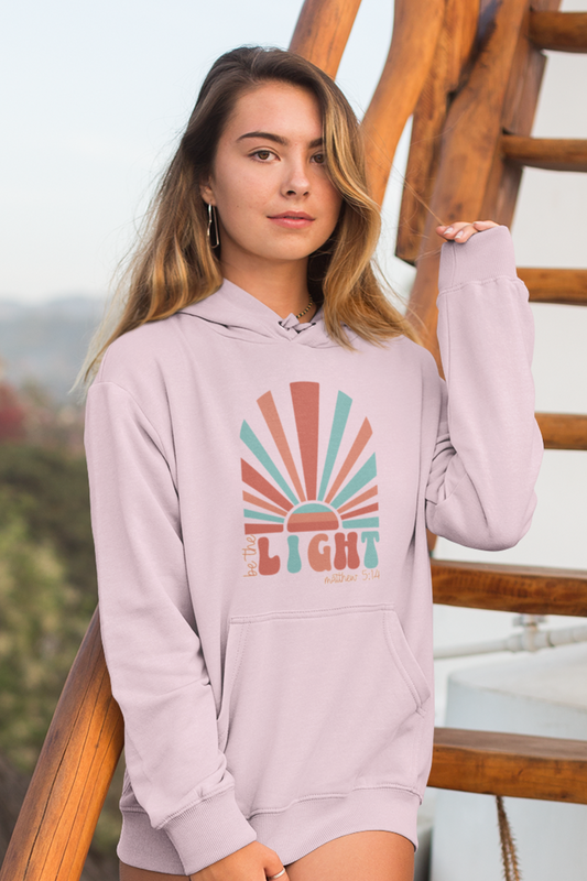 woman-in-beach-wearing-be-the-light-christain-hoodie-pink2