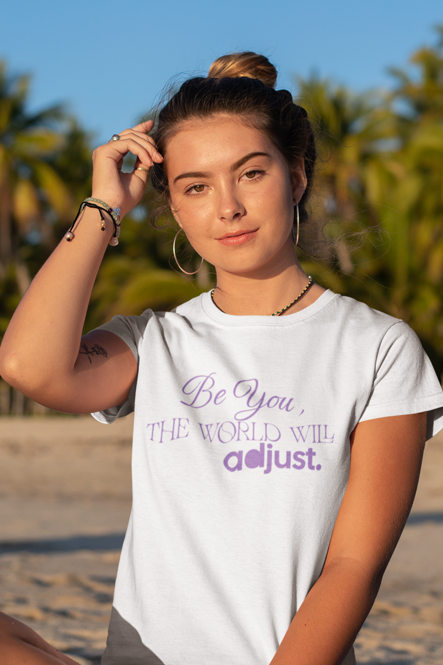 woman-in-beach-wearing-be-you-the-world-will-adjust-tee-white