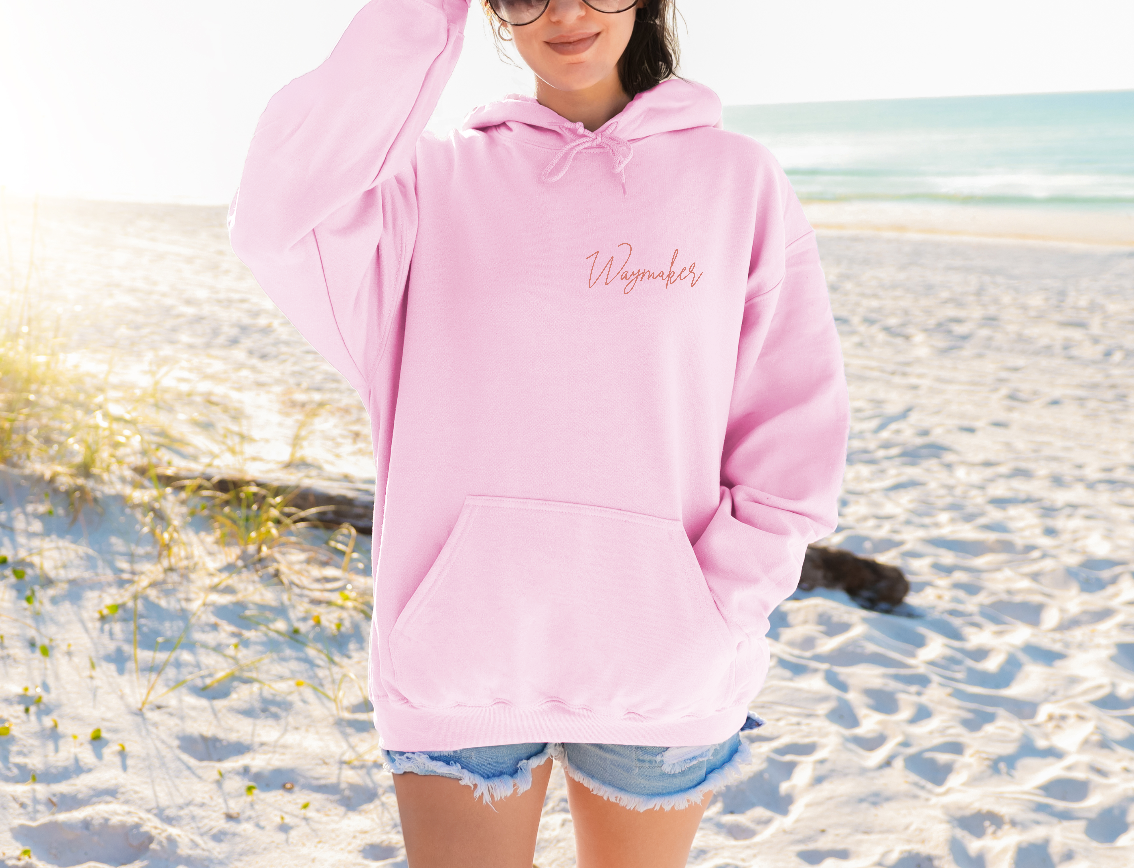 woman-in-each-waymaker-hoodie-light-pink