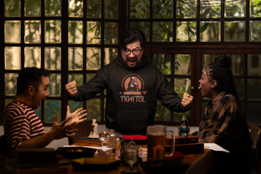 man-wearing-fantasy-hoodie-celebrating-after-rolling-dice