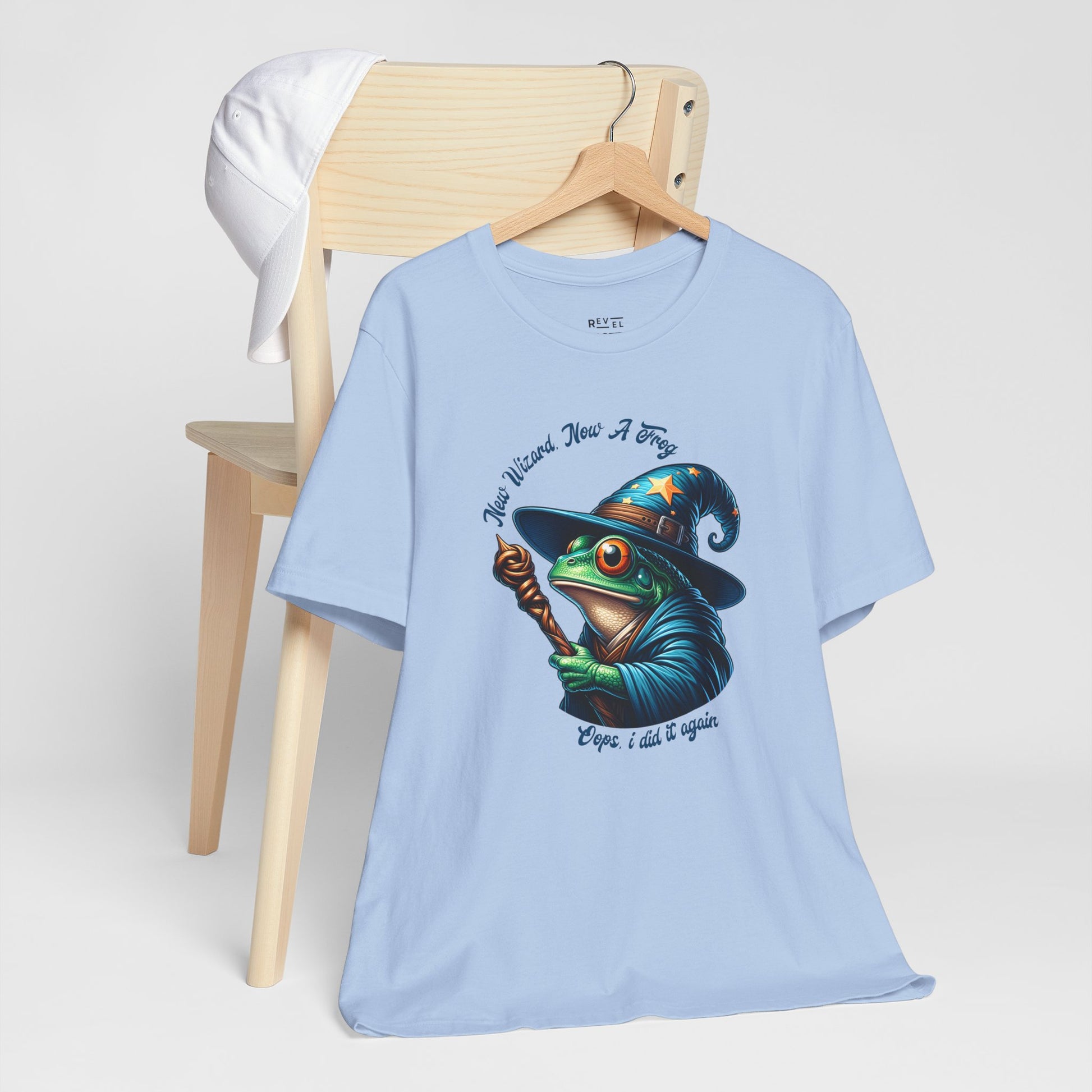 Light-blue-t-shirt-with-a-graphic-of-a-frog-in-a-wizard-hat.