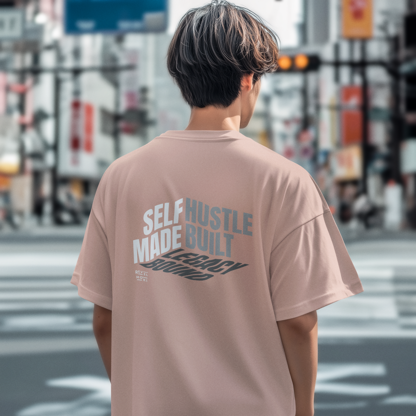 person-wearing-t-shirt-back-of-tee-that-says-self-made-hustle-built-legacy-bound-color-peach