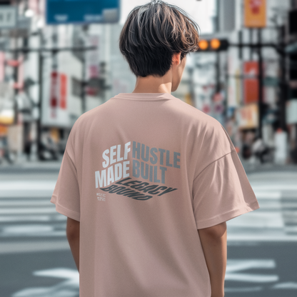 person-wearing-t-shirt-back-of-tee-that-says-self-made-hustle-built-legacy-bound-color-peach
