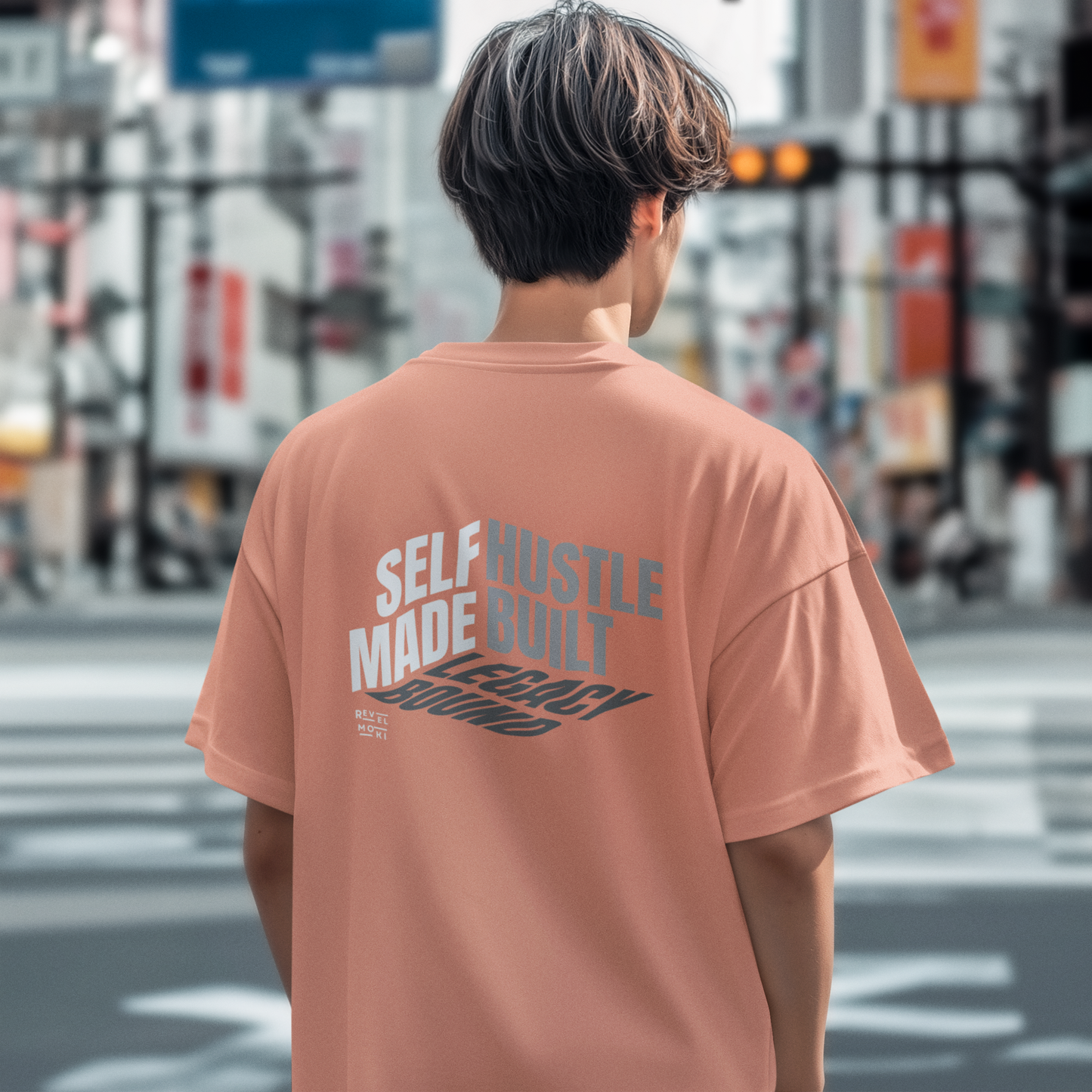 person-wearing-t-shirt-back-of-tee-that-says-self-made-hustle-built-legacy-bound-color-sunset