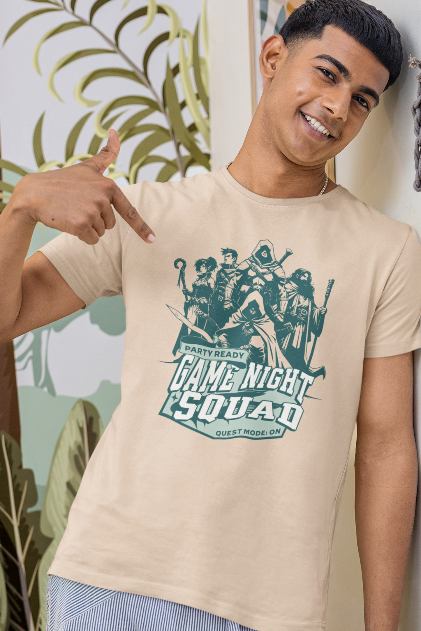Person-wearing-a-t-shirt-with-'Game-Night-Squad'-graphic-design-color-cream