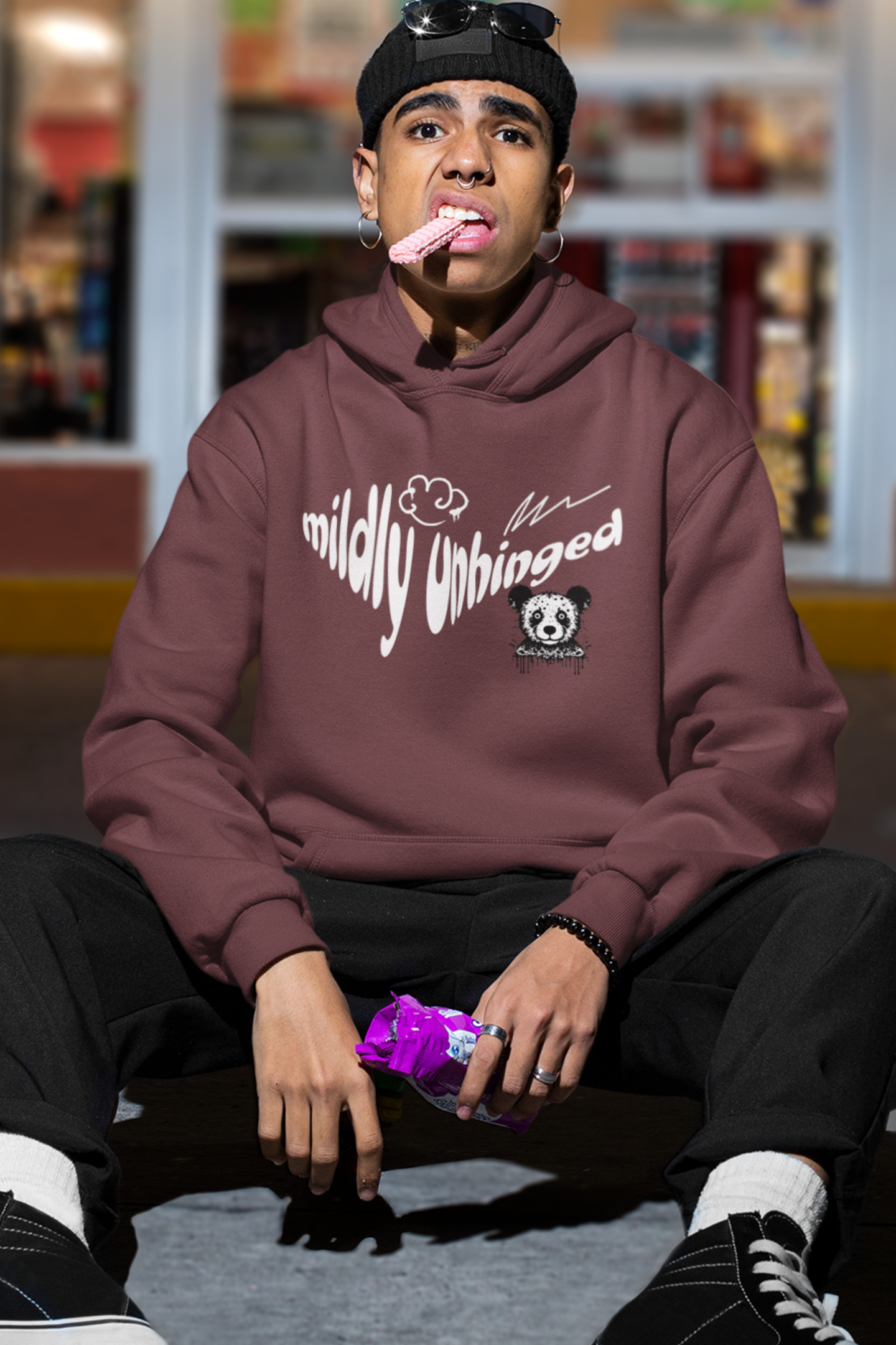 man-wearing-funny-hoodie-that-says-mildly-unhinged-maroon