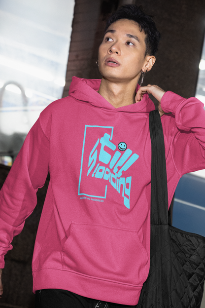 person-wearing-hoodie-with-blue-graphic-design-that-says-still-loading-work-in-progress-color-pink