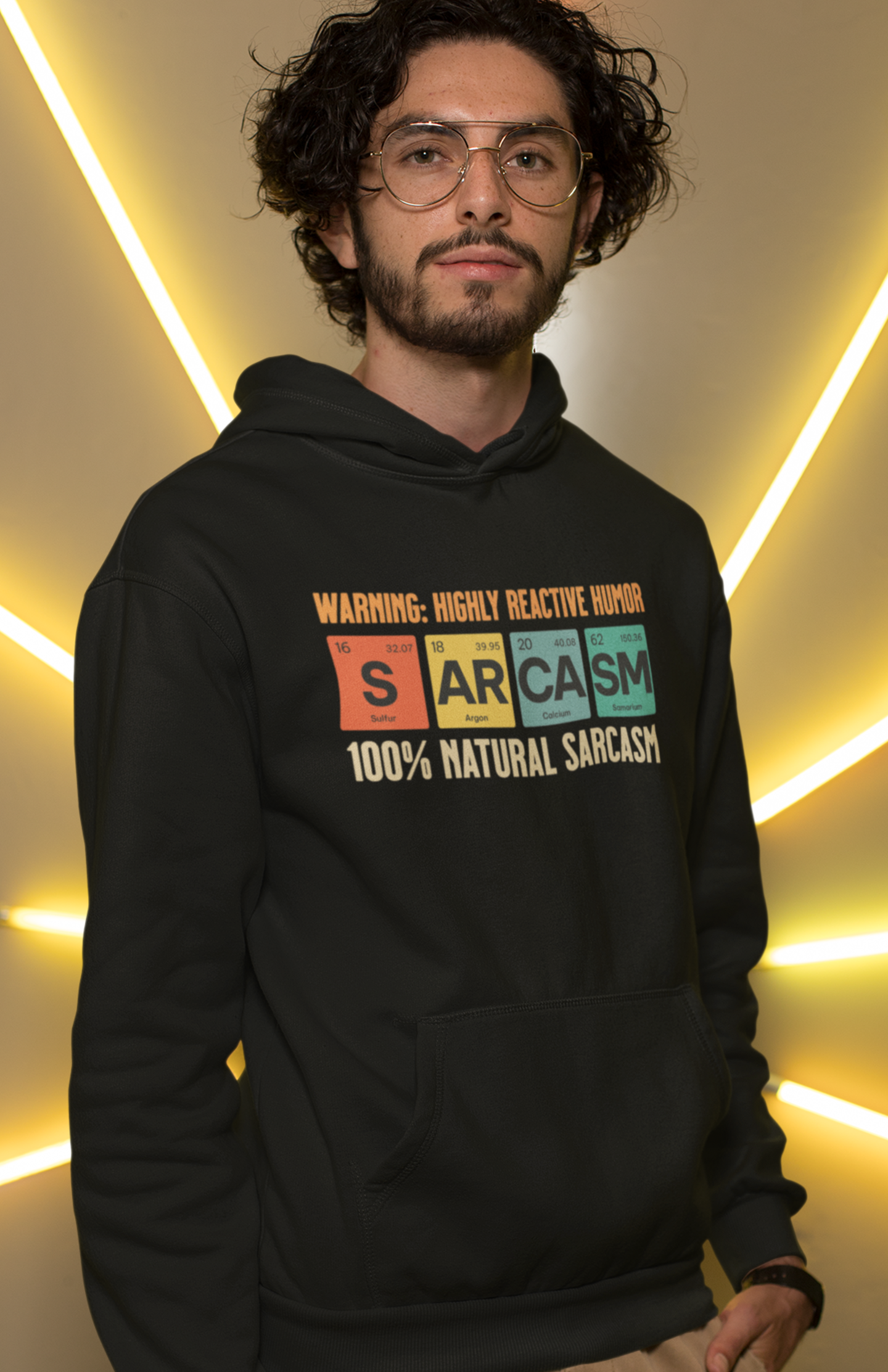 man-wearing-black-hoodie-showing-graphic-design-of-elements-from-periodic-table-spells-sarcasm