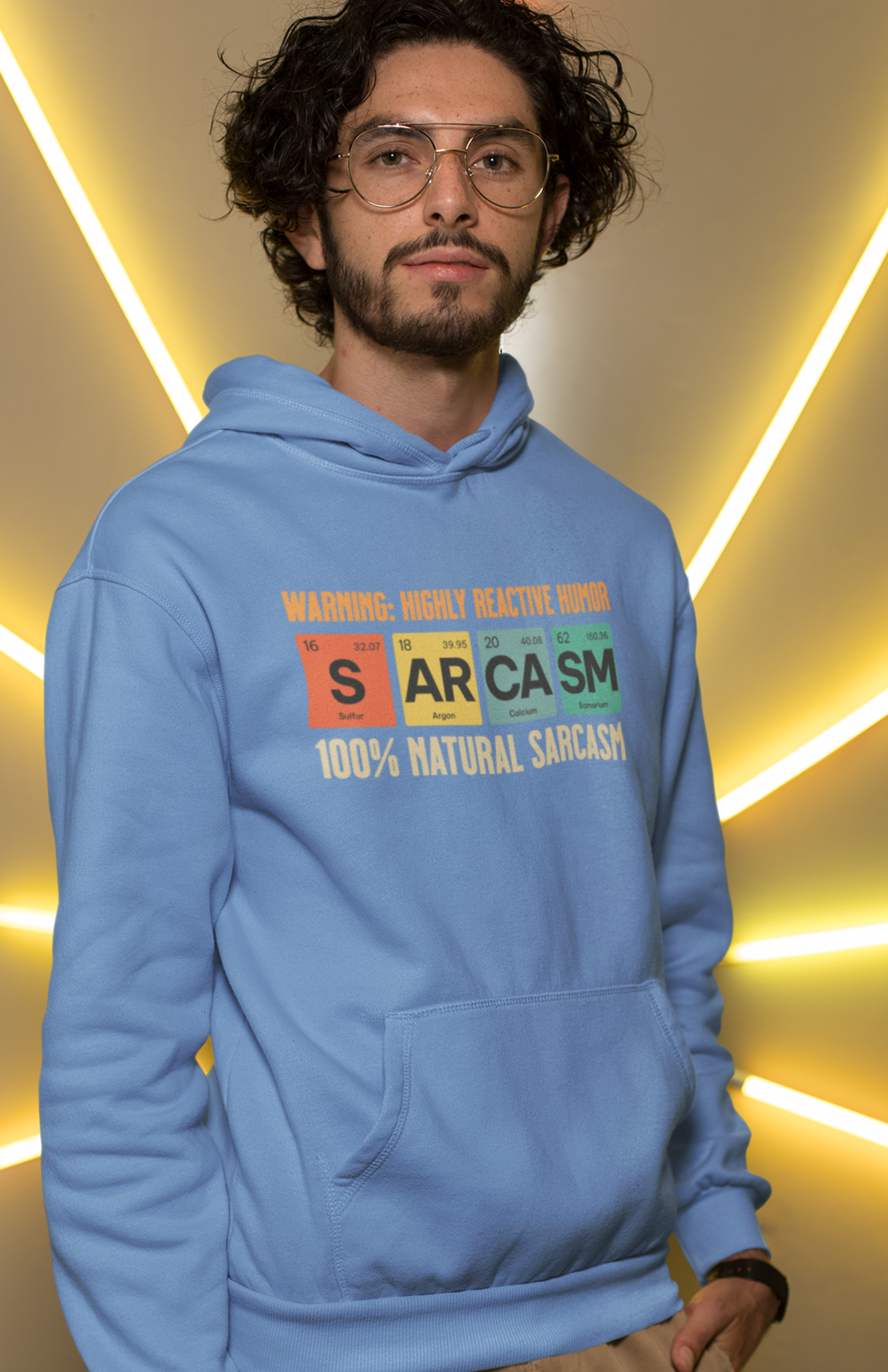 man-wearing-blue-hoodie-showing-graphic-design-of-elements-from-periodic-table-spells-sarcasm