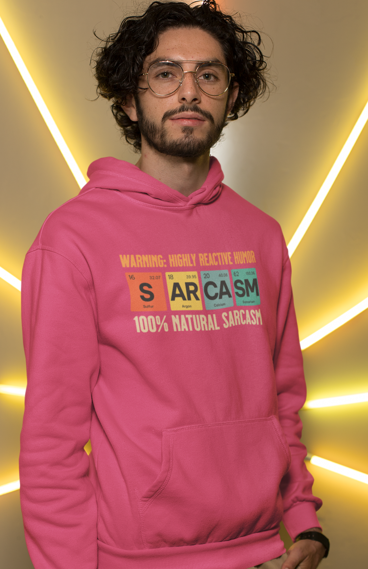 man-wearing-pink-hoodie-showing-graphic-design-of-elements-from-periodic-table-spells-sarcasm