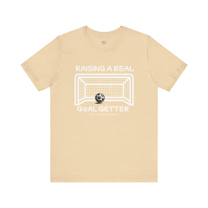 raising-a-real-goalgetter-soccer-mom-tee-closeup-cream