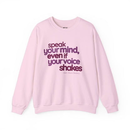 short-haired-woman-pulling-down-her-sweatshirt-wearing-women-empoowerment-shirt-closeup-pink