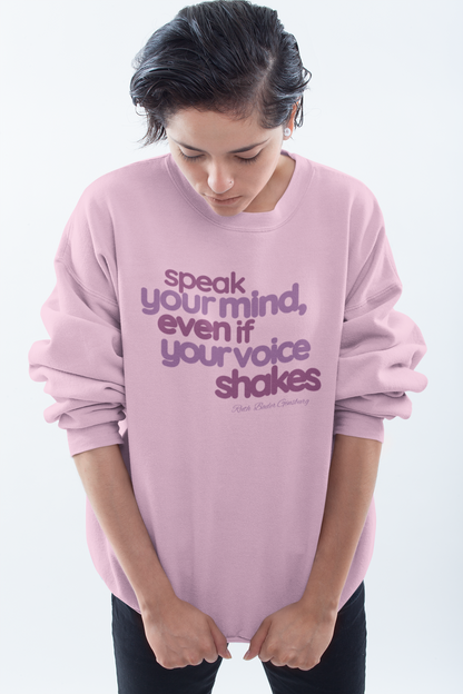short-haired-woman-pulling-down-her-sweatshirt-wearing-women-empoowerment-shirt-pink