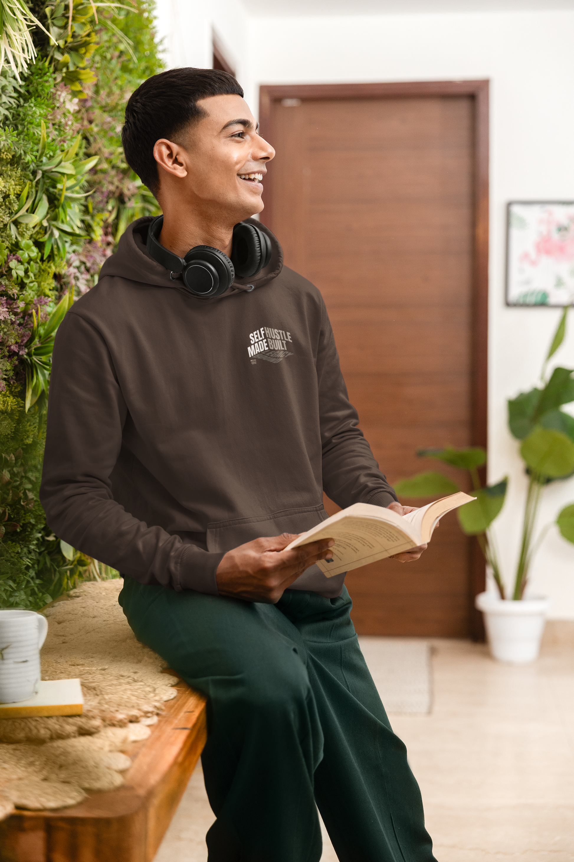 person-wearing-front-of-hoodie-says-self--made-hustle-built-legacy-bound-color-brown