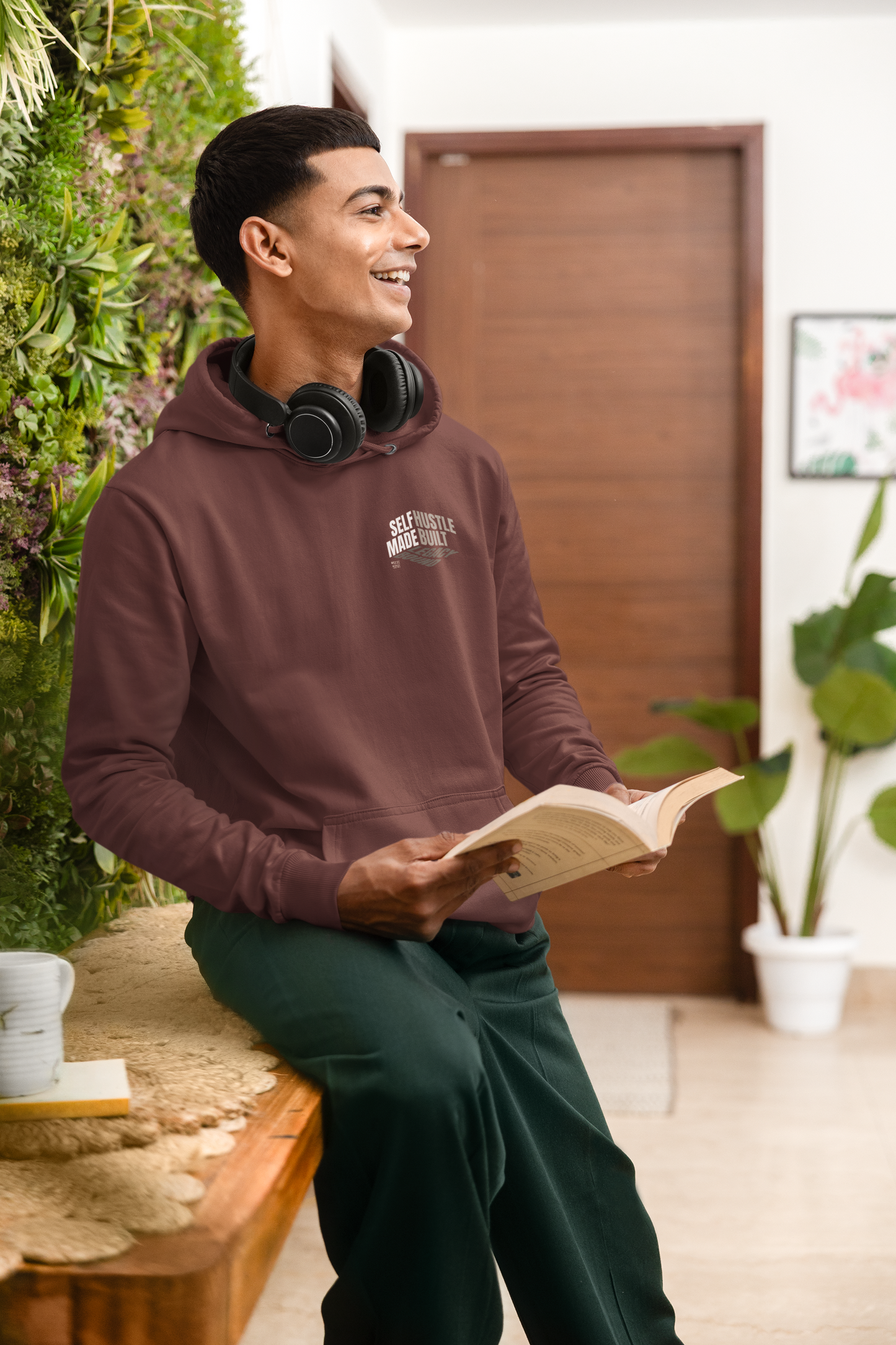person-wearing-front-of-hoodie-says-self--made-hustle-built-legacy-bound-color-maroon