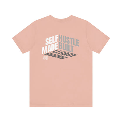 back-of-tee-that-says-self-made-hustle-built-legacy-bound-color-peach