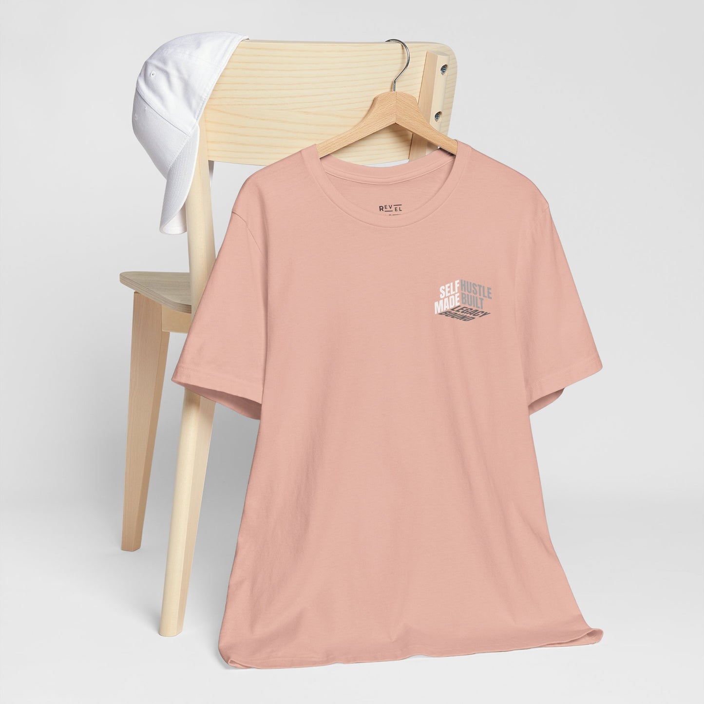 front-of-tee-that-says-self-made-hustle-built-legacy-bound-color-peach