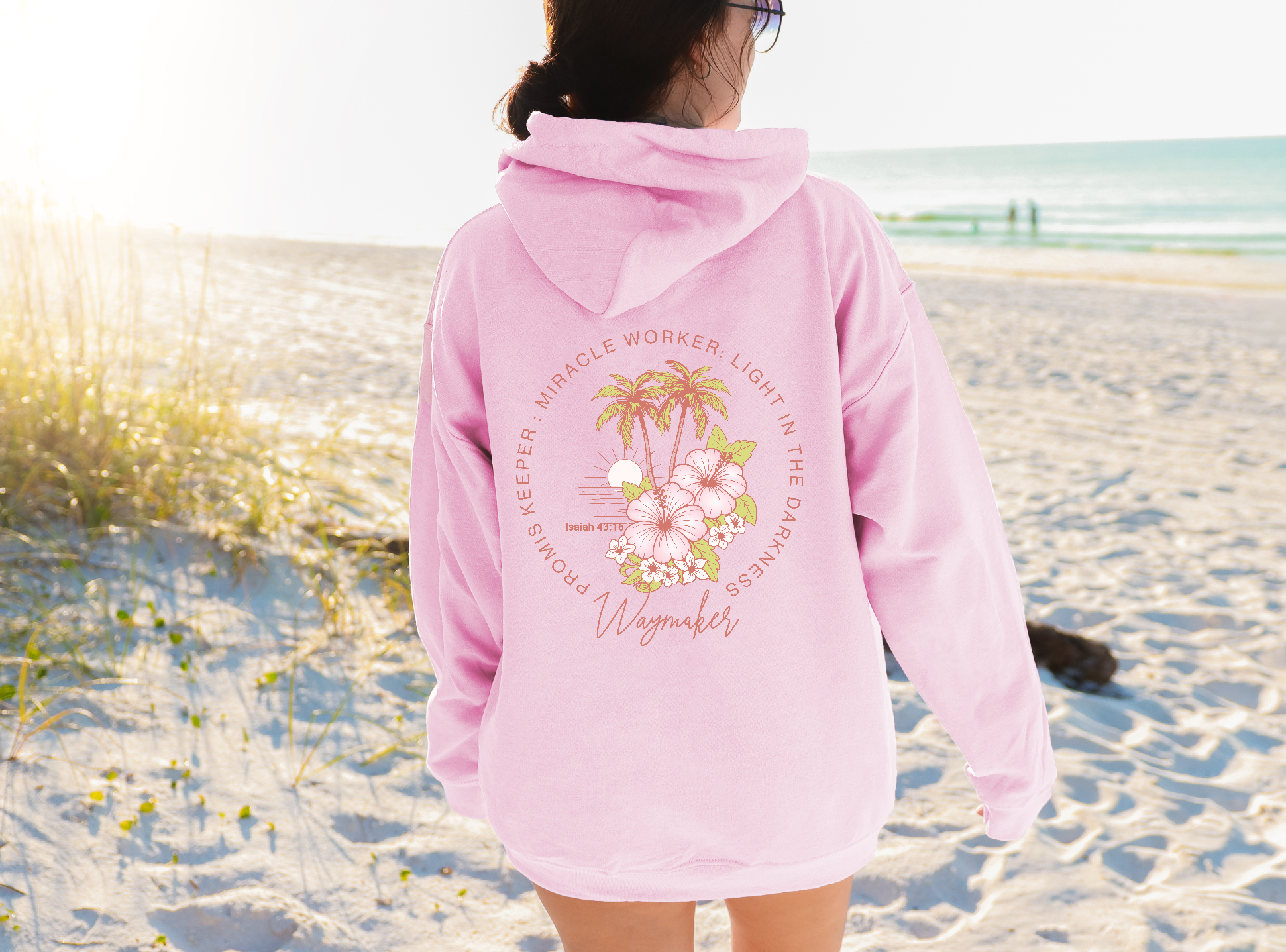 woman-in-beach-back-of-waymaker-hoodie-light-pink