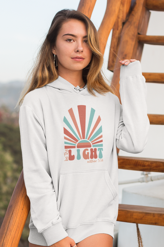 woman-in-beach-wearing-be-the-light-christain-hoodie-white2