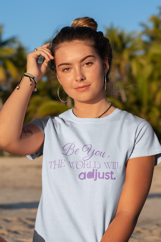 woman-in-beach-wearing-be-you-the-world-will-adjust-tee-blue