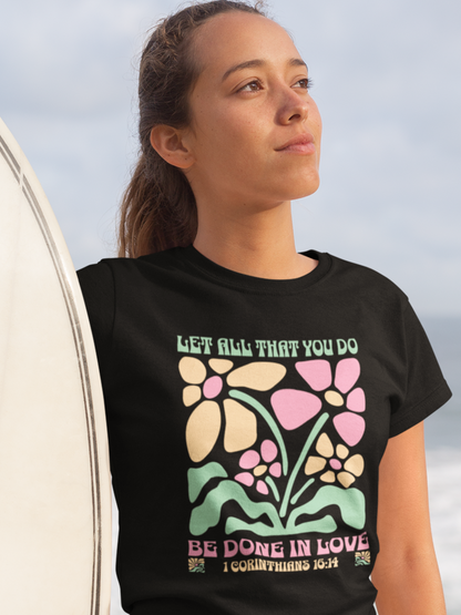 woman-in-beach-with-surfboard-wearing-christian-tee-black