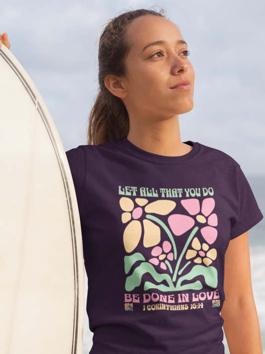 woman-in-beach-with-surfboard-wearing-christian-tee-purple
