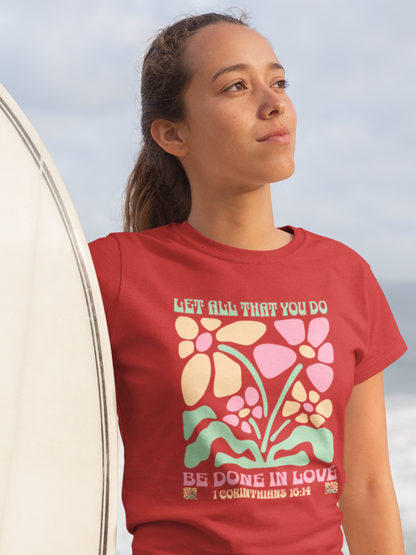 woman-in-beach-with-surfboard-wearing-christian-tee-red