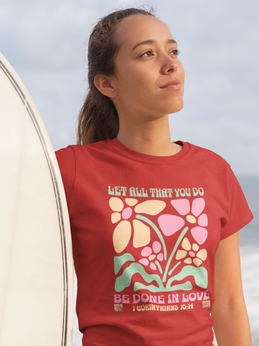woman-in-beach-with-surfboard-wearing-christian-tee-red